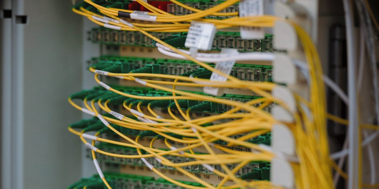 Network equipment rack with status lights and connected cabling