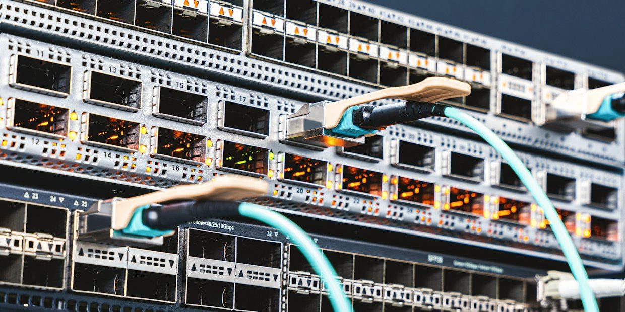 Rows of server racks in a data center aisle