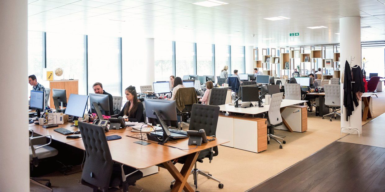 Open-plan office with people working at desks