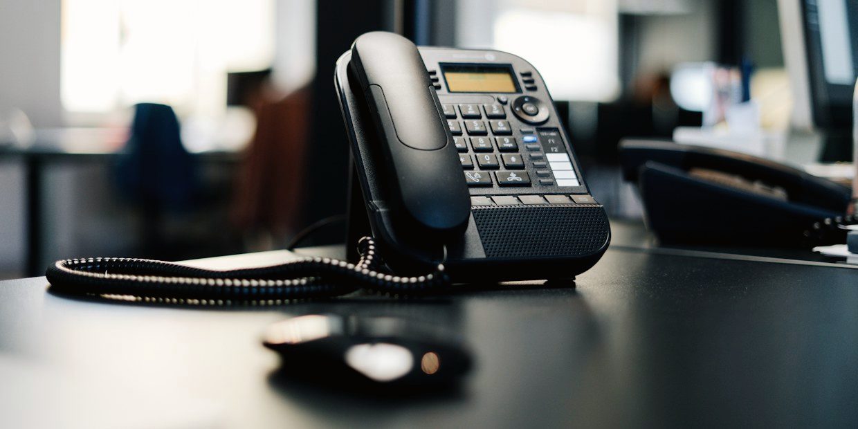 VoIP desk phone on an office desk